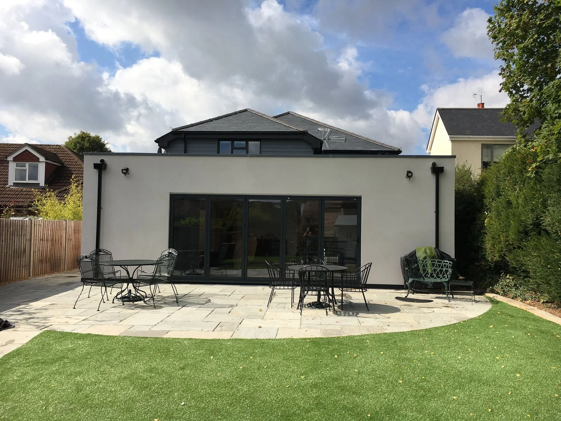 Rendered single-storey rear extension with bi-fold doors