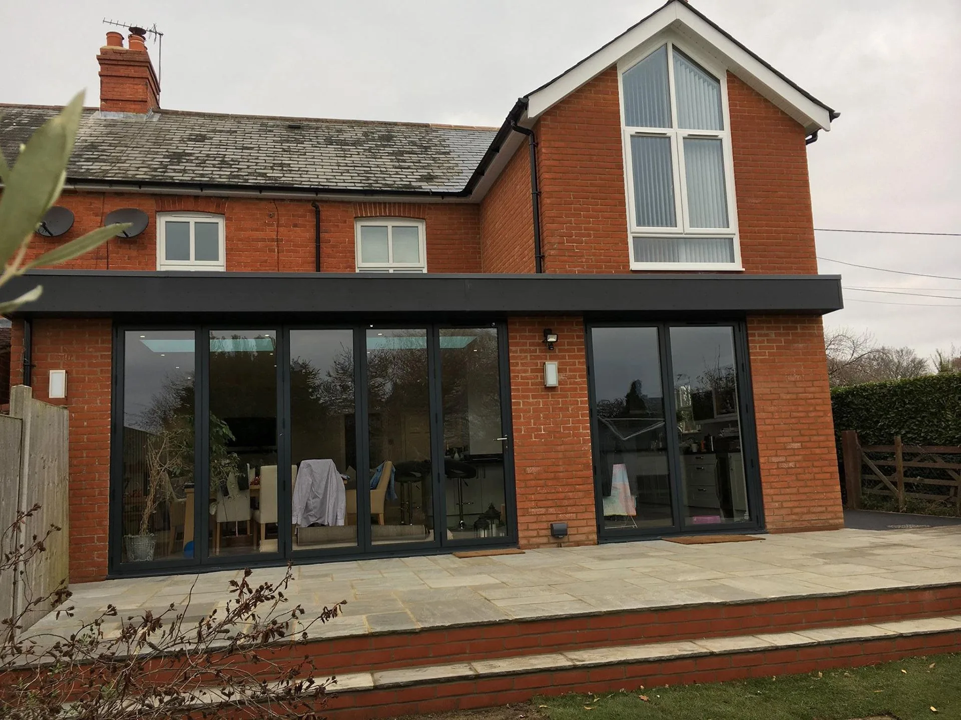 Two-storey brick extension with bi-fold doors