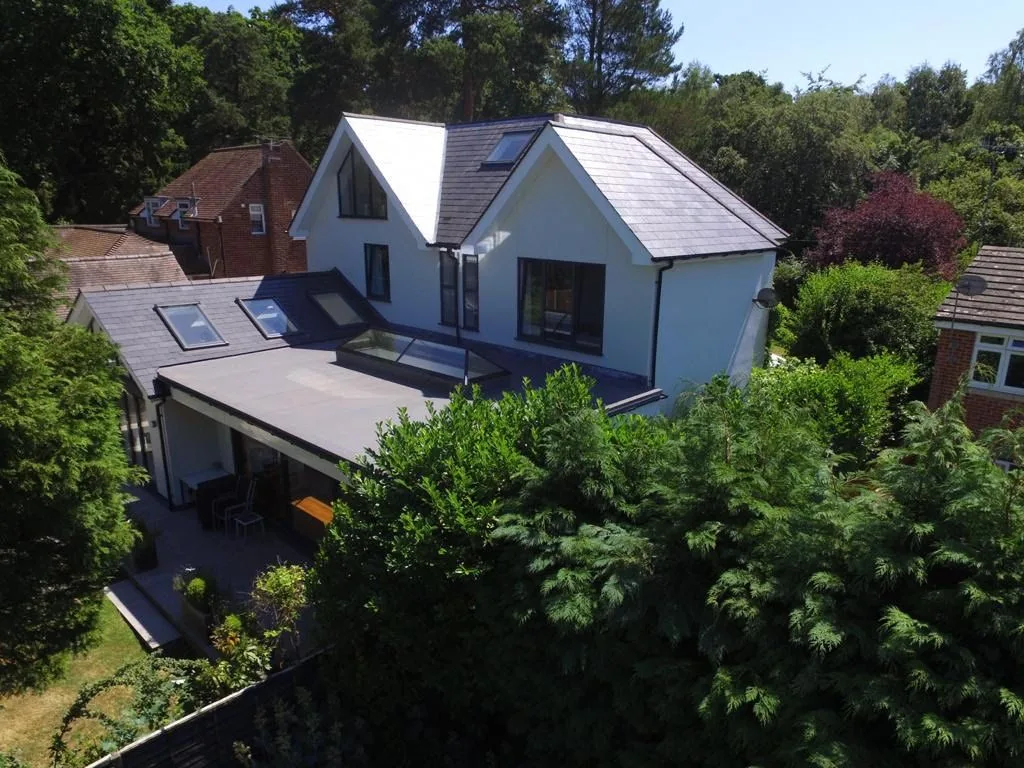 Aerial view of an extended detached house